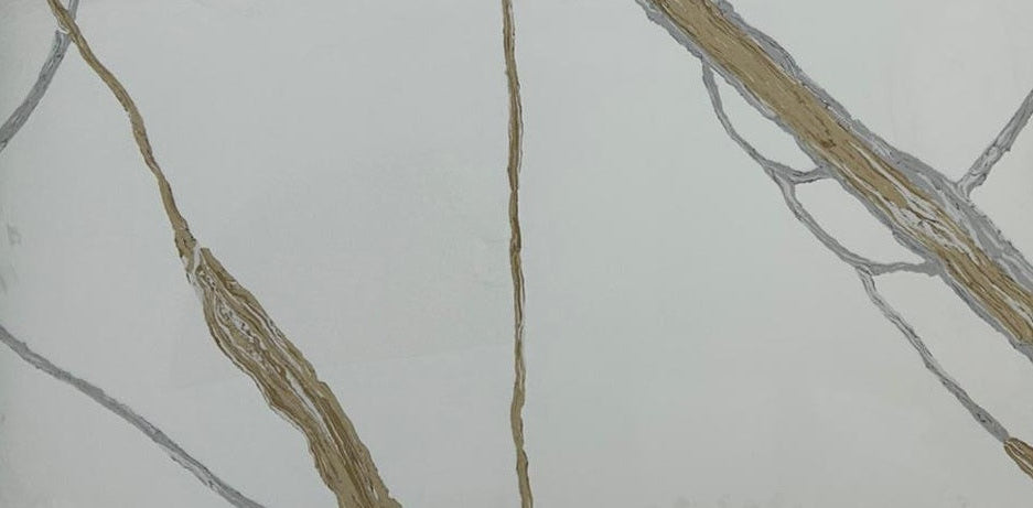 Close-up of a marble-like tile with gold and gray veins on a white background